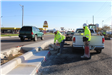 Making controlled cuts in curbs along Sagamore Parkway