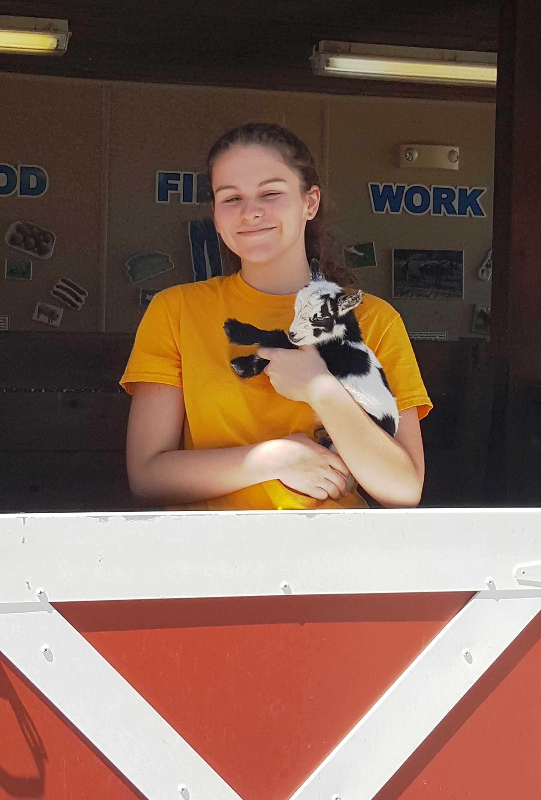 Zoo Teen and baby goat