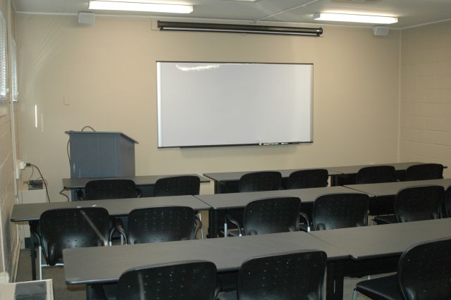 Classroom environment with a whiteboard at the front of the classroom
